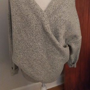 Grey criss/cross sweater.